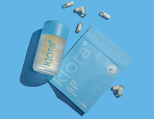 Klora Gut-Renew prebiotic and postbiotic refillable jar and refill pill pack with capsules on blue background